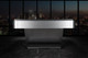 Wide profile view of the Doc & Holliday Poshy Reverse Rainbow Slate Pool Table, showing its brushed silver metallic base, reverse rainbow accents, Euro Blue Championship felt, and matte black upper rails, staged on a concrete floor with a clean modern backdrop wall. Wide profile view of the Doc & Holliday Poshy Reverse Rainbow Slate Pool Table, showing its brushed silver metallic base, reverse rainbow accents, Euro Blue Championship felt, and matte black upper rails, staged on a concrete floor with a clean modern backdrop wall.